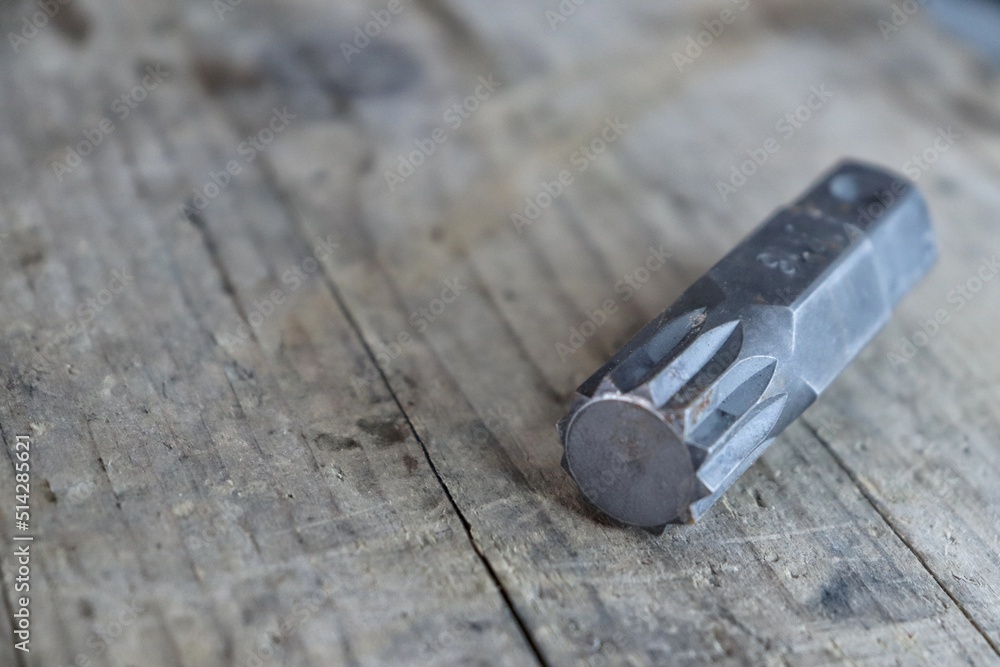 Torx piece on a wooden prank Torx piece on a wooden prank