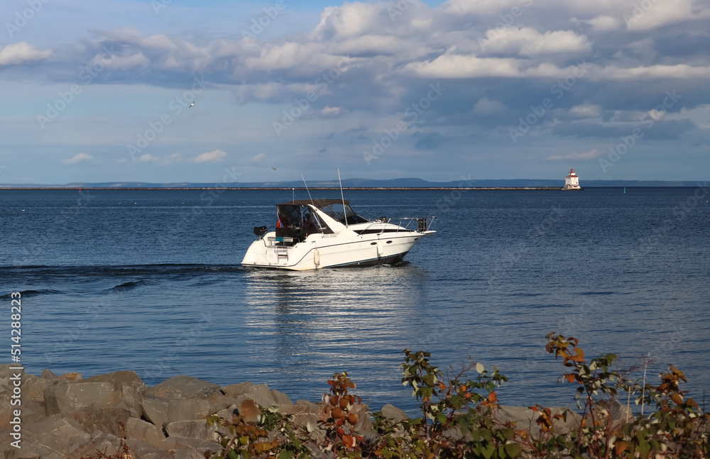 Recreation vessel sailing away from the marina - Thunder Bay Marina, Ontario, Canada