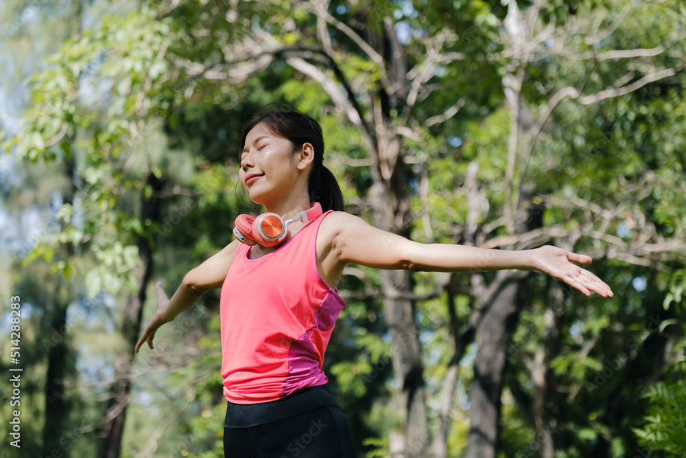Asian woman doing exercise in park. Asian woman doing exercise in park.