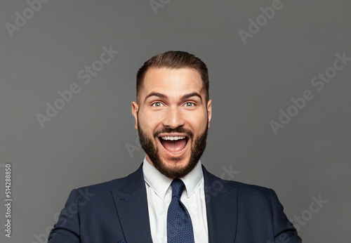 Young happy businessman with really impressive achievements screaming with happiness, male face close up