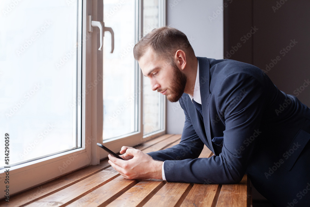 Businessman using mobile phone app texting with clients Businessman using mobile phone app texting with clients