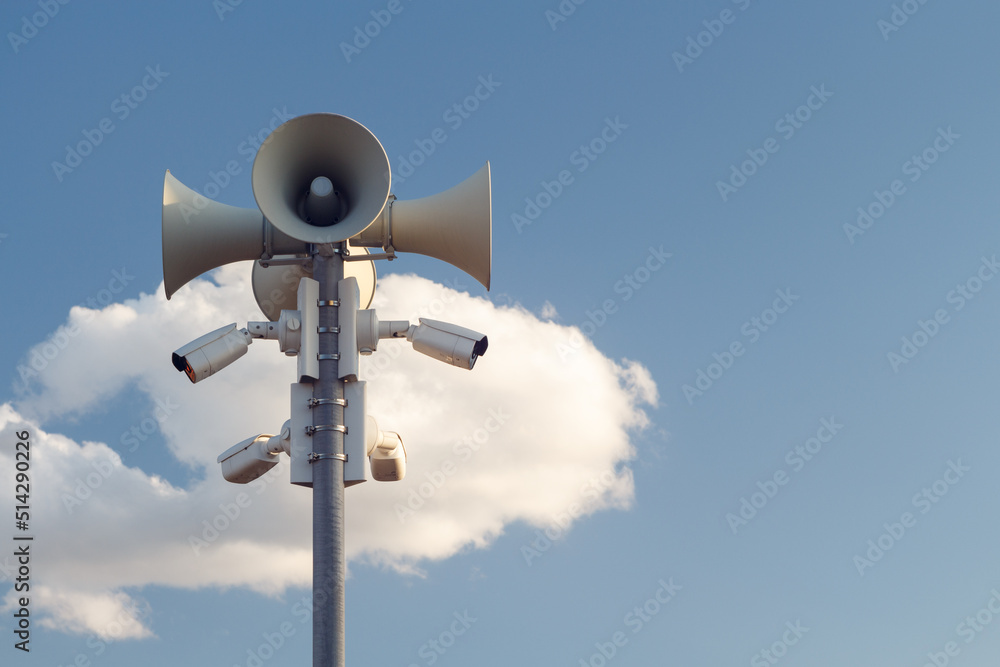 Megaphones and video cameras on the mast outdoors. Copy space. Megaphones and video cameras on the mast outdoors. Copy space.