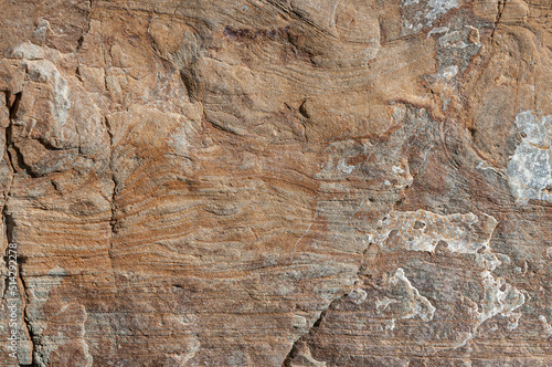 Stone textured background is color of dry sand of gray and white coating of details. Natural sand stone background.