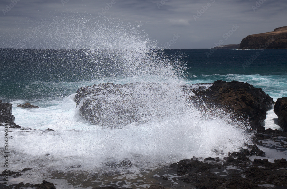 Gran Canaria, north west coast around natural swimming pools Salinas de Agaete,
waves breaking against old eroded dark lava platform Gran Canaria, north west coast around natural swimming pools Salinas de Agaete,
waves breaking against old eroded dark lava platform