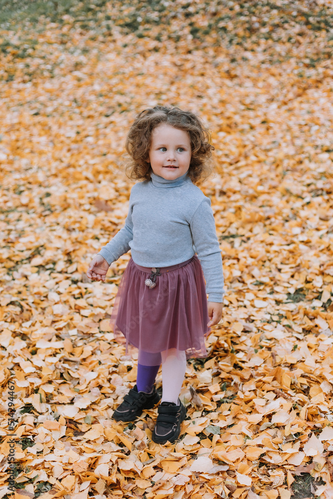 beautiful little girl playing with yellow leaves in park at fall time, autumn, card, healthy beautiful little girl playing with yellow leaves in park at fall time, autumn, card, healthy