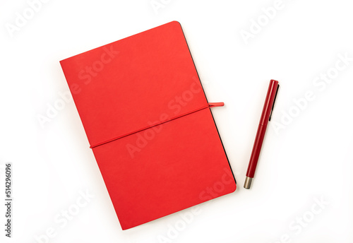 Blank red hardcover book and red pen isolated on white background with copy space. 

Clipping parh Included photo