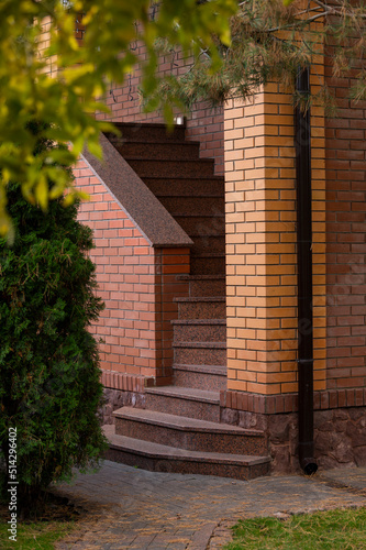 Marble staircase with steps and railings on the facade