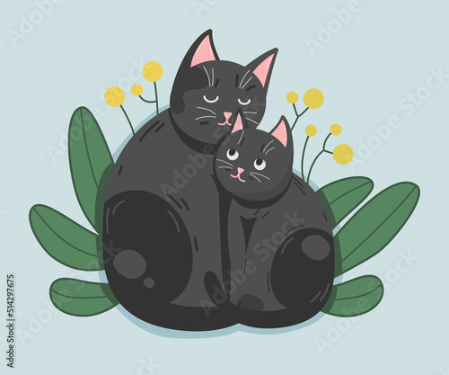 2 two black cats in green grass with yellow flowers