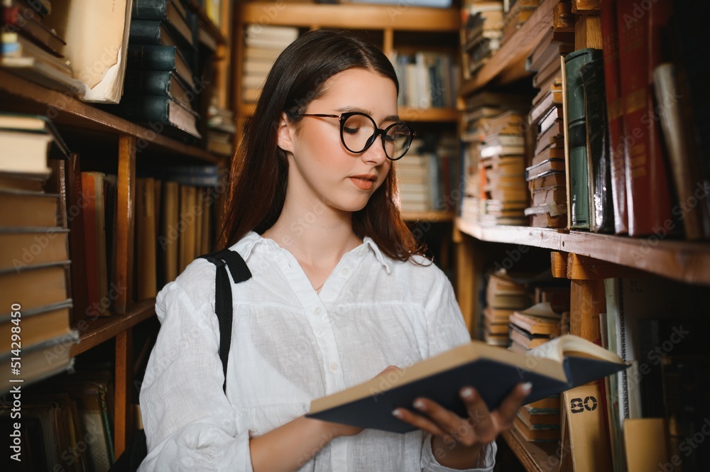 Portrait of a beautiful student in a library Portrait of a beautiful student in a library