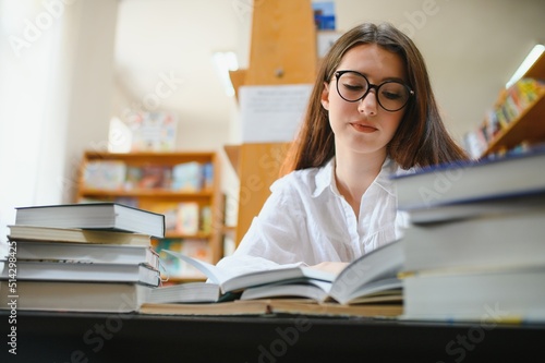 Beautiful girl in a library