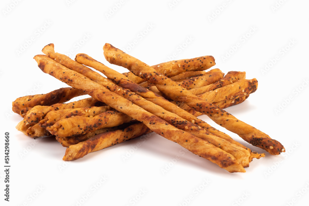 Handmade salted baked sticks with sesame and poppy seeds isolated on bright background. Close up view. Handmade salted baked sticks with sesame and poppy seeds isolated on bright background. Close up view.