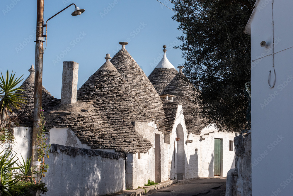 Iconic residential houses in historic Trulli district in Alberobello, Southern Italy