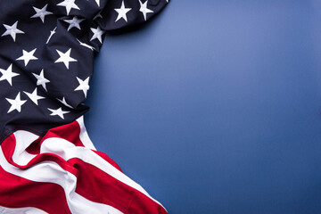 The flag of the United States of America on blue background with copy space