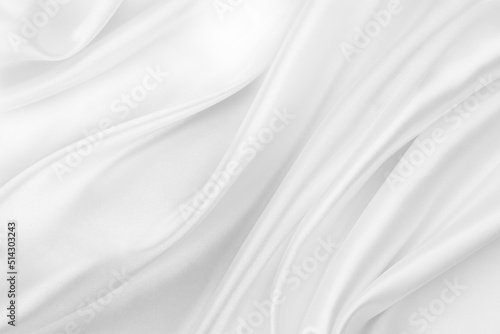 Close-up of rippled white silk fabric texture background 