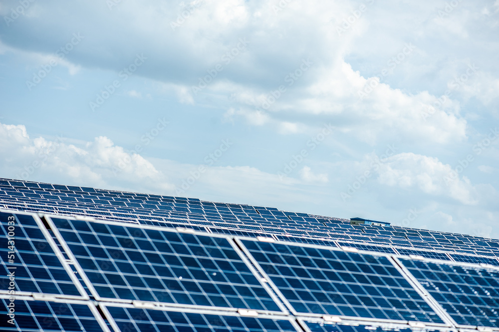 Solar panels and blue sky. Solar panels system power generators from sun. Clean technology for better future Solar panels and blue sky. Solar panels system power generators from sun. Clean technology for better future