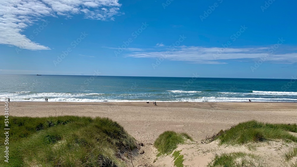 beautiful beach with few people photographed from the dunes in summer in denmark, jutland, vrist, midtjylland, North Sea, Lemvig, harboøre