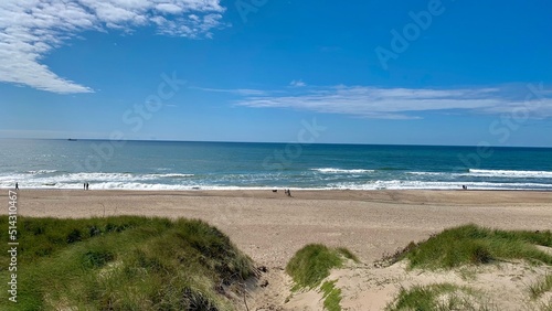 beautiful beach with few people photographed from the dunes in summer in denmark, jutland, vrist, midtjylland, North Sea, Lemvig, harboøre
