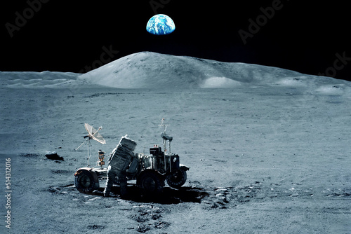 Fototapeta Naklejka Na Ścianę i Meble -  Astronaut on the moon, near the moon rover. Elements of this image furnished by NASA