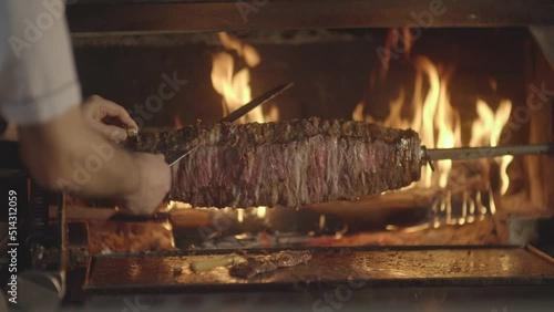 Details of the master and delicious kebab making Turkish kebab by the hearth