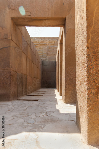 Beige stone walls of corridor near the Great Pyramid of Giza, Egypt. Architectural landmark in Africa. © Konstantin Aksenov