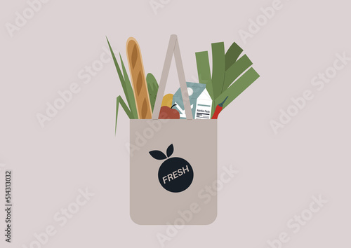 A shopping tote bag filled with farmers market groceries
