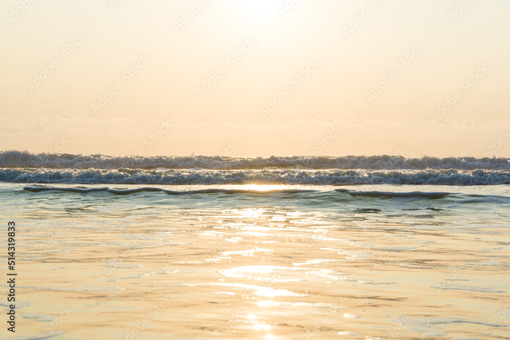 Obraz premium Sunset sunrise on sea wave beach nature background