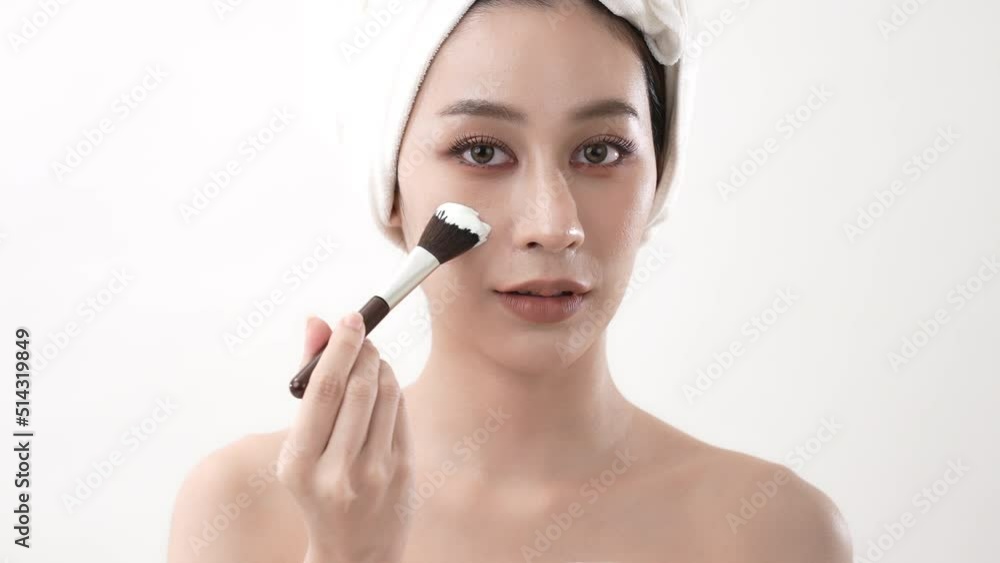 Spa concept of 4k Resolution. Asian woman applying facial cream in bedroom. Mud Mask. green tea extract. Spa concept of 4k Resolution. Asian woman applying facial cream in bedroom. Mud Mask. green tea extract.