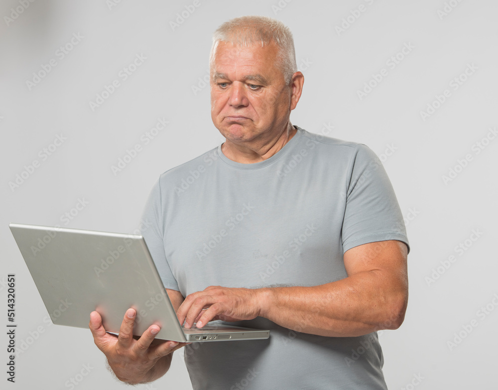 senior elderly man using laptop with different emotions studio photo isolated senior elderly man using laptop with different emotions studio photo isolated