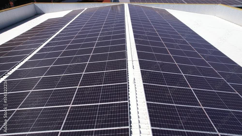 Solar panel of a photovoltaic system on top of the roof, being filmed by a drone, thinking about sustainability. Solar panel of a photovoltaic system on top of the roof, being filmed by a drone, thinking about sustainability.