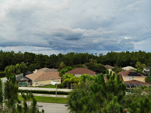 Tampa, FL USA - 06 20:2022: House and thunder storm cloud