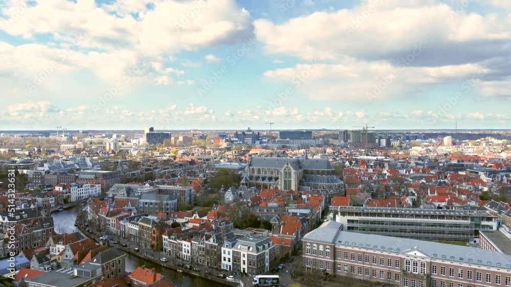 Aerial shot flying up over the ancient city of Leiden, revealing the Faculty of Law of Leiden University, the Pieterskerk and the Rapenburg canal Aerial shot flying up over the ancient city of Leiden, revealing the Faculty of Law of Leiden University, the Pieterskerk and the Rapenburg canal