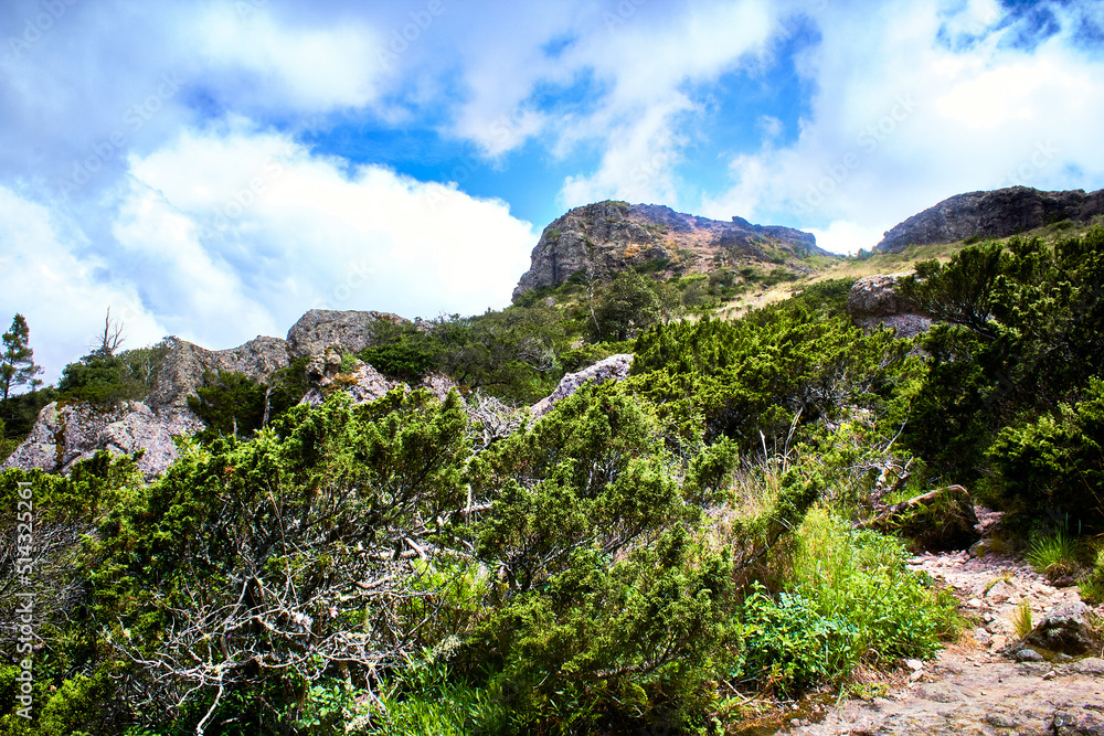 big mountain with blue sky and clouds green grass and big rocks on mineral del chico hidalgo big mountain with blue sky and clouds green grass and big rocks on mineral del chico hidalgo