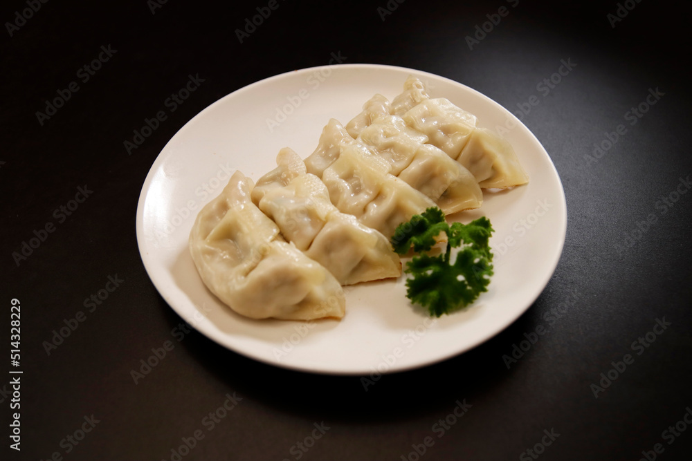 Freshly baked dumplings with plenty of gravy on the table Freshly baked dumplings with plenty of gravy on the table