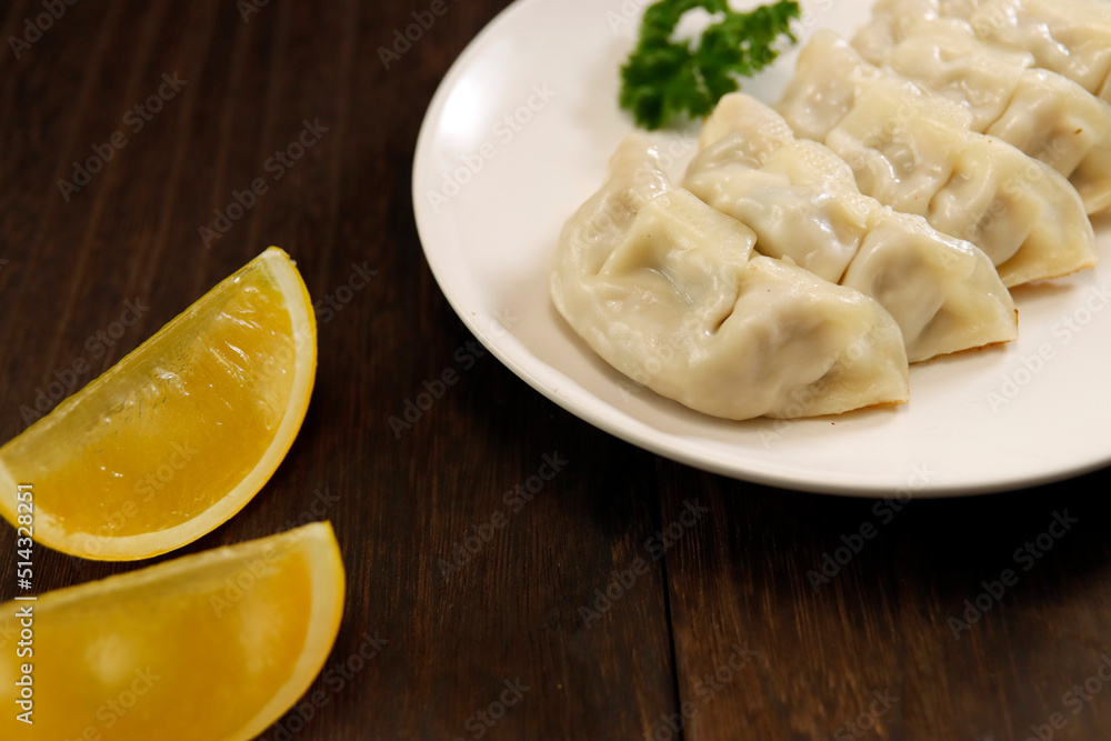 Freshly baked dumplings with plenty of gravy on the table Freshly baked dumplings with plenty of gravy on the table