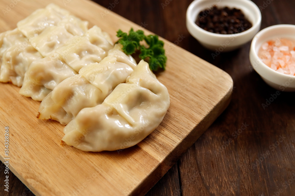 Freshly baked dumplings with plenty of gravy on the table Freshly baked dumplings with plenty of gravy on the table