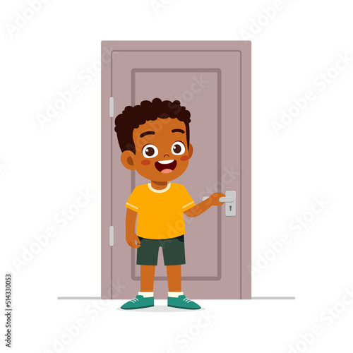 little kid standing and holding door knob