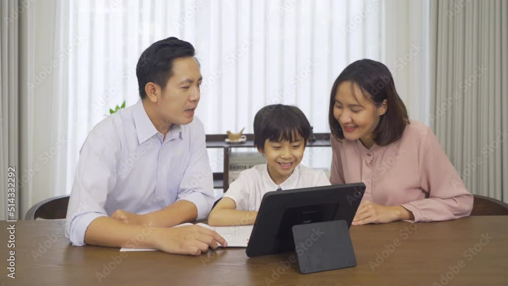 Portrait of happy smiling Asian Family. A student studying homework online from school at home or house in family relationship. Love of father, mother, and son. People lifestyle. Education activity. Portrait of happy smiling Asian Family. A student studying homework online from school at home or house in family relationship. Love of father, mother, and son. People lifestyle. Education activity.