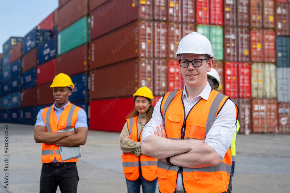 Group of engineer worker and manager standing in the shipping yard container. Group of engineer worker and manager standing in the shipping yard container.