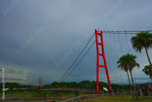 Red suspension bridge of Agongdian Reservoir. The first reservoir to be completed in Taiwan after World War II. Kaohsiung City, 2022