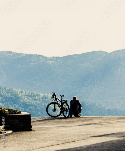 Person and mountain bike with landscape 
