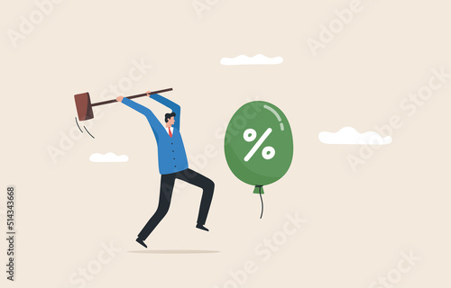 Beat inflation. .controlling inflation by raising interest rates. economic risk or investment bubble. Businessman trying to hit balloons with a hammer. photo