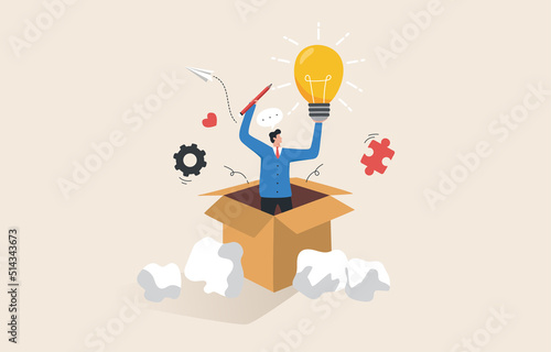 Discovering new creative ideas. Think outside the box. Solving work problems through innovation. Businessman holding a light bulb idea out of a box.