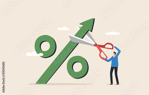 Stop Inflation. Economic crisis, Fed raised the central bank interest rate to curb soaring inflation. Businessman cuts a percentage mark with scissors.