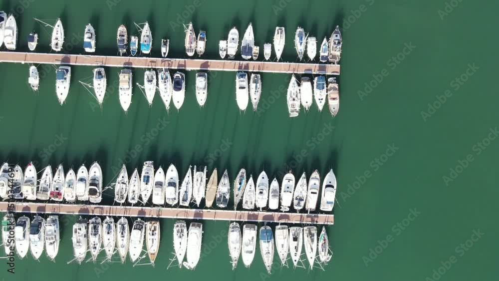 Straight Down View of Port in Mallorca With Boats from Left to Right in Green Water Straight Down View of Port in Mallorca With Boats from Left to Right in Green Water