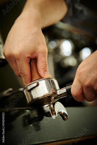 Close-up of barista hands in cafe