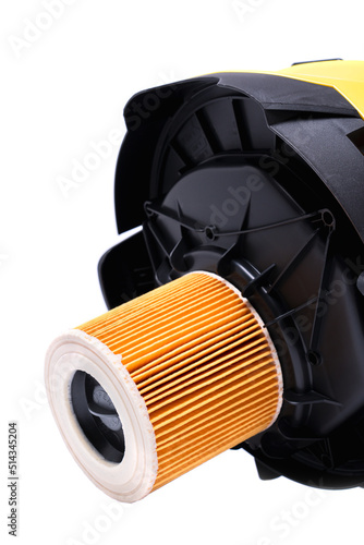 air filter on the cover of a yellow construction vacuum cleaner, isolate on a white background