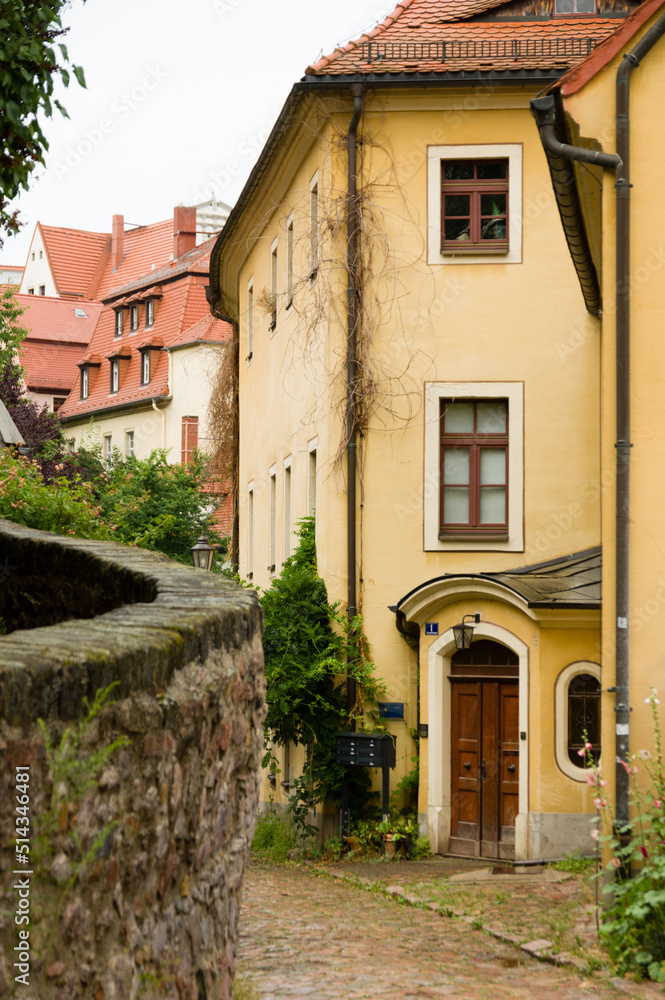 Houses in old narrow street with cobble stones in Meissen, Germany