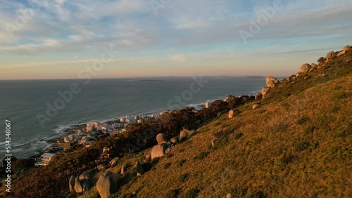 aerial over Lions Head at sunset revealing Sea Point in Cape Town South Africa