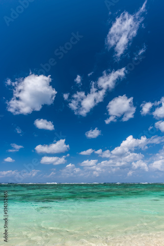 Dramatic sky in sunny day at a paradise beach, crystal clear turquoise water.