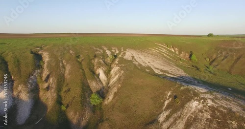 flying over beautiful white chalk hills with grass in summer